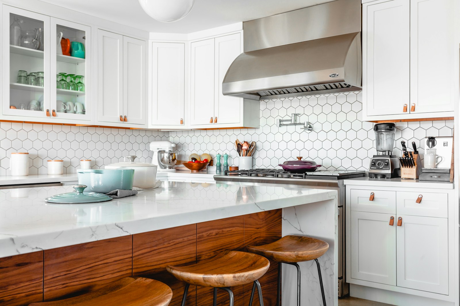 Kitchen design inspiration with cabinetry, tile backsplash, and island